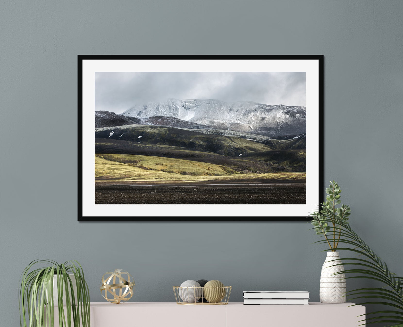 A framed print of a mountain range in Iceland
