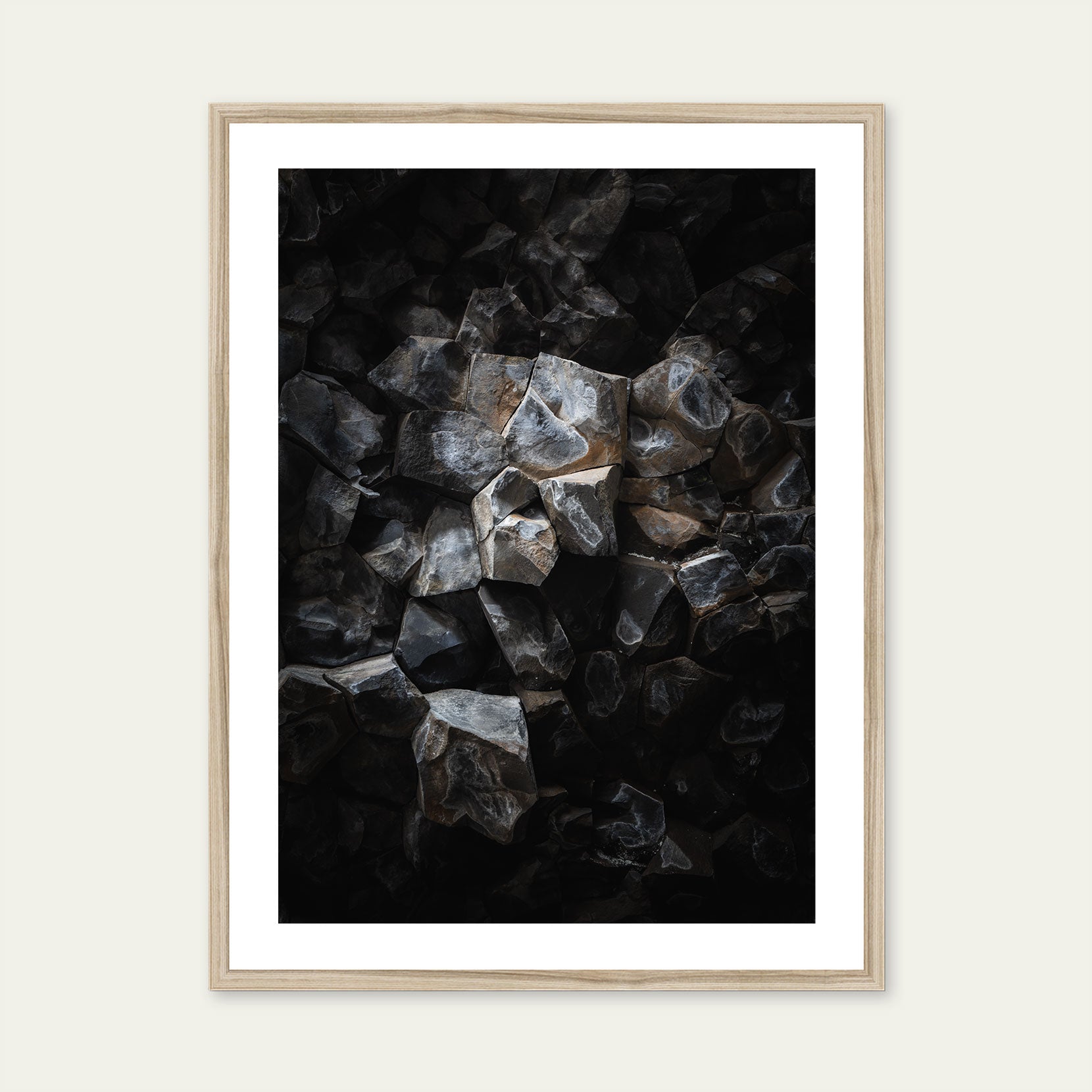 A wood framed print of a detail from a basalt cave 