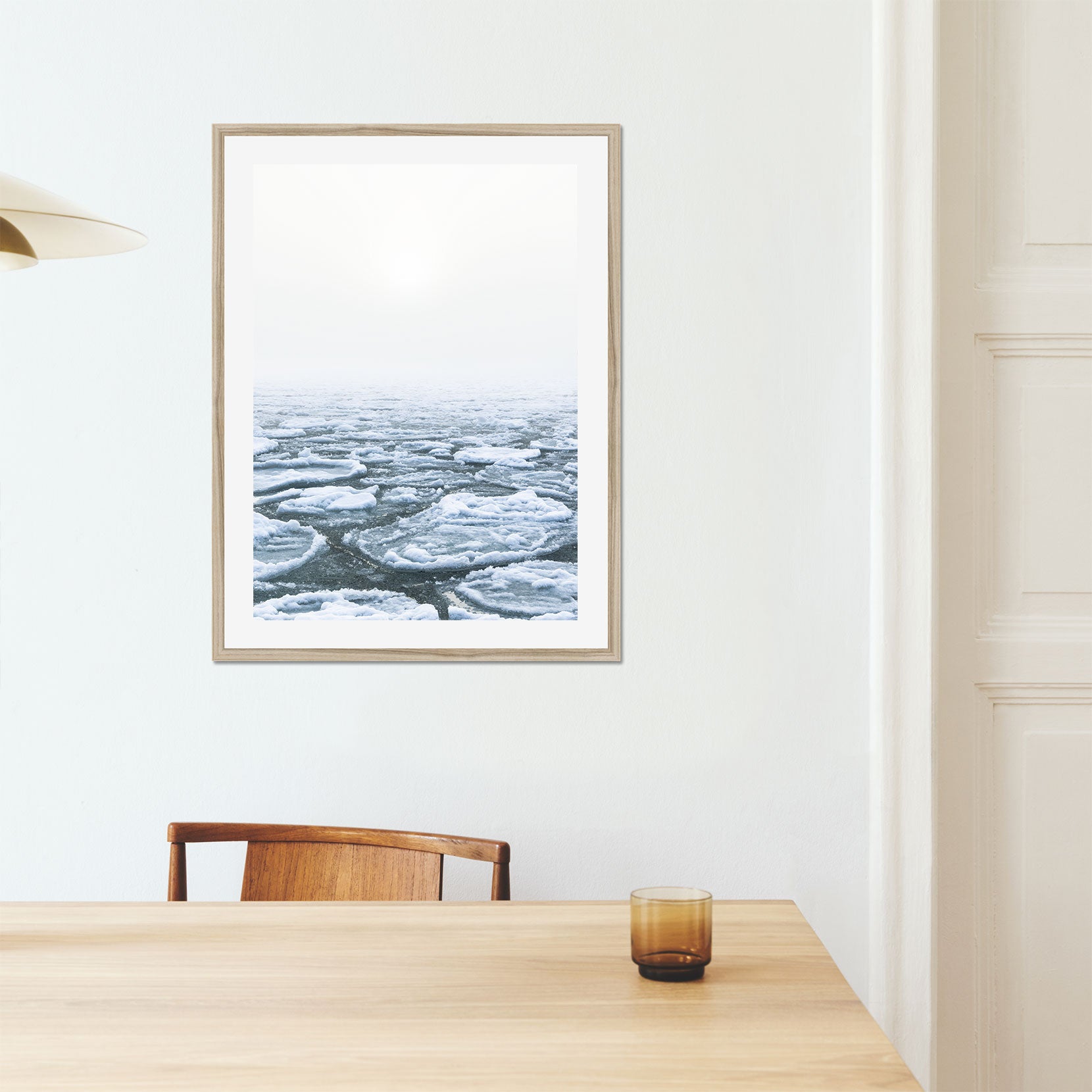 A framed print of ice pans on foggy winter day