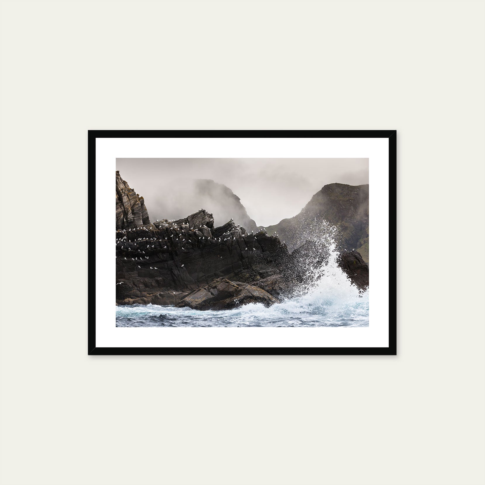 A black framed print of a rough and rugged coast in Norway