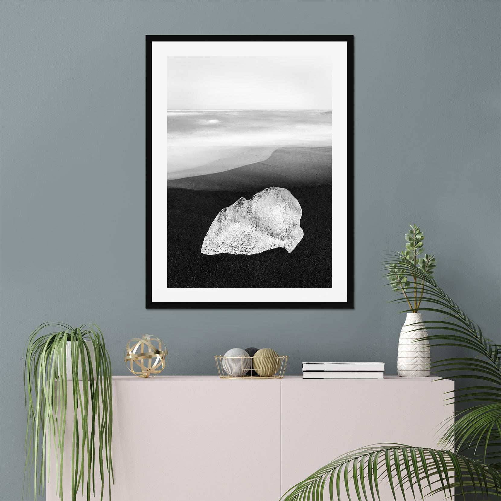 A framed print of a ice on black sand beach