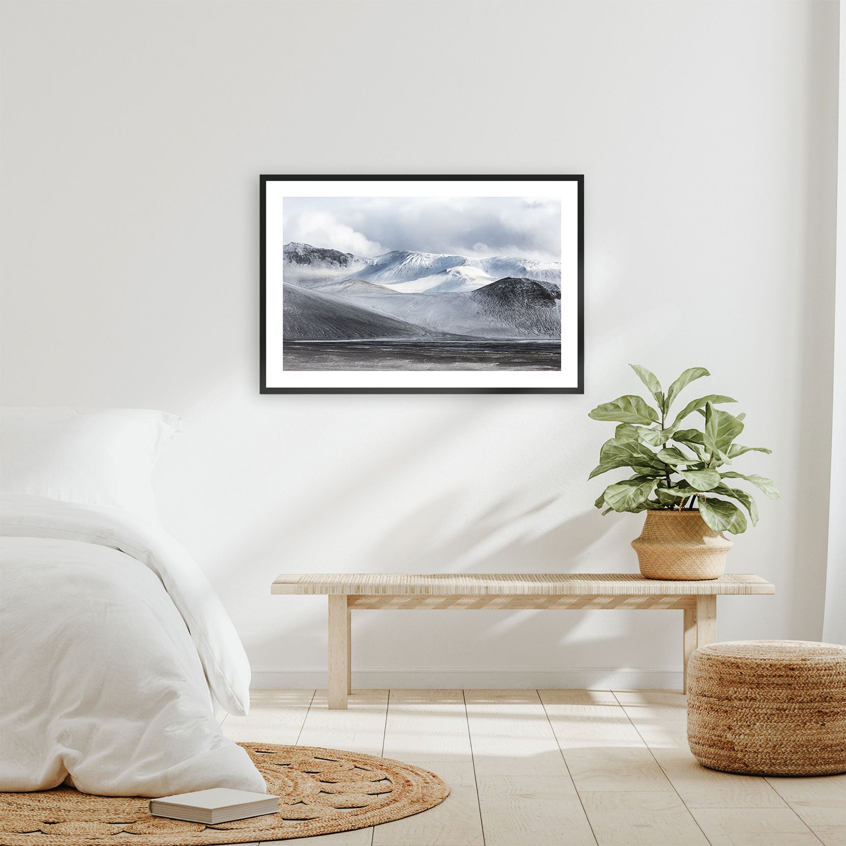 A framed print of a snowy mountain range in Iceland