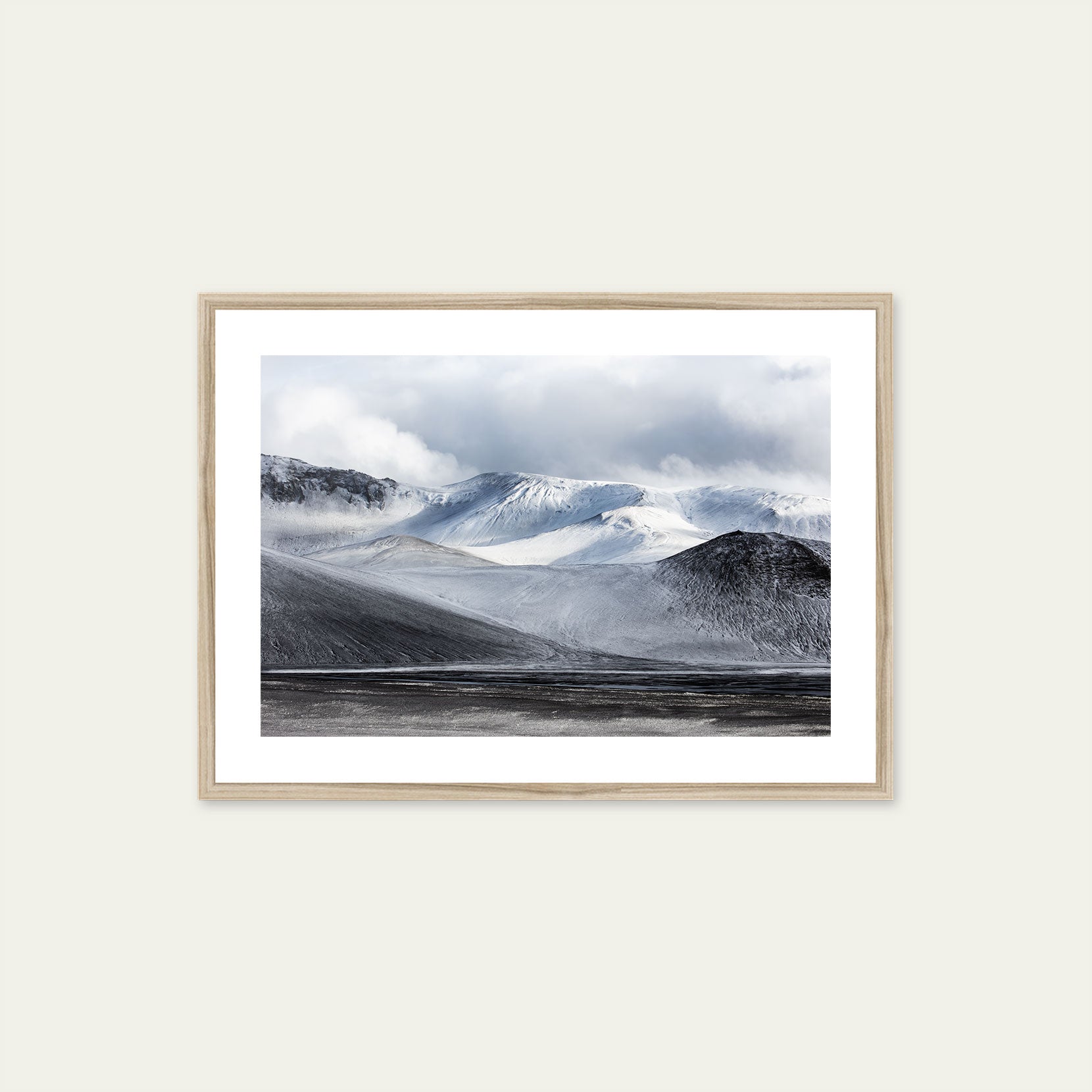 A wood framed print of a snowy mountain range in Iceland