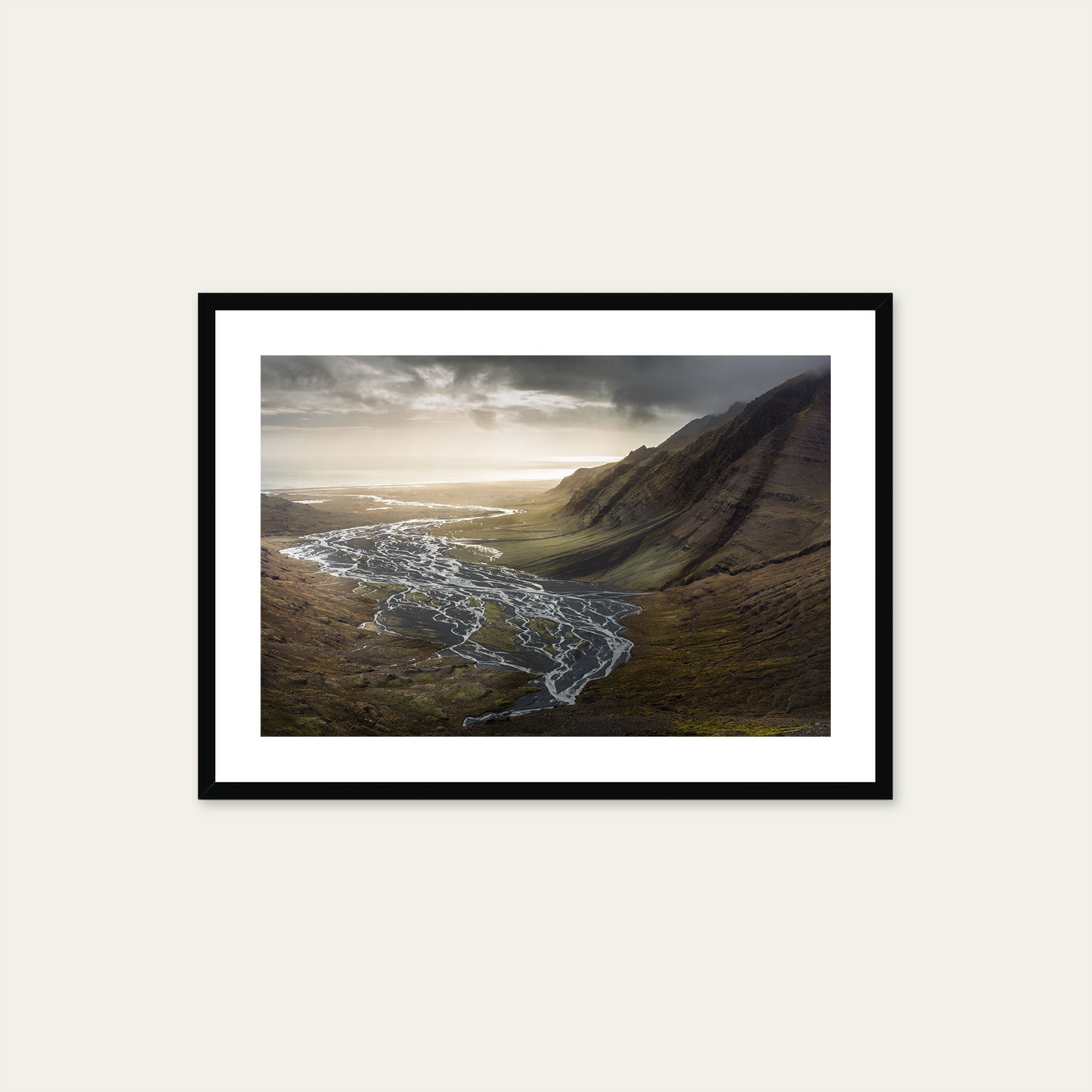 A black framed print of a valley in the south of Iceland